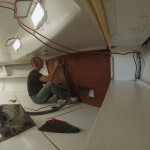 Sanding the aft bulkhead in the aft cabin.